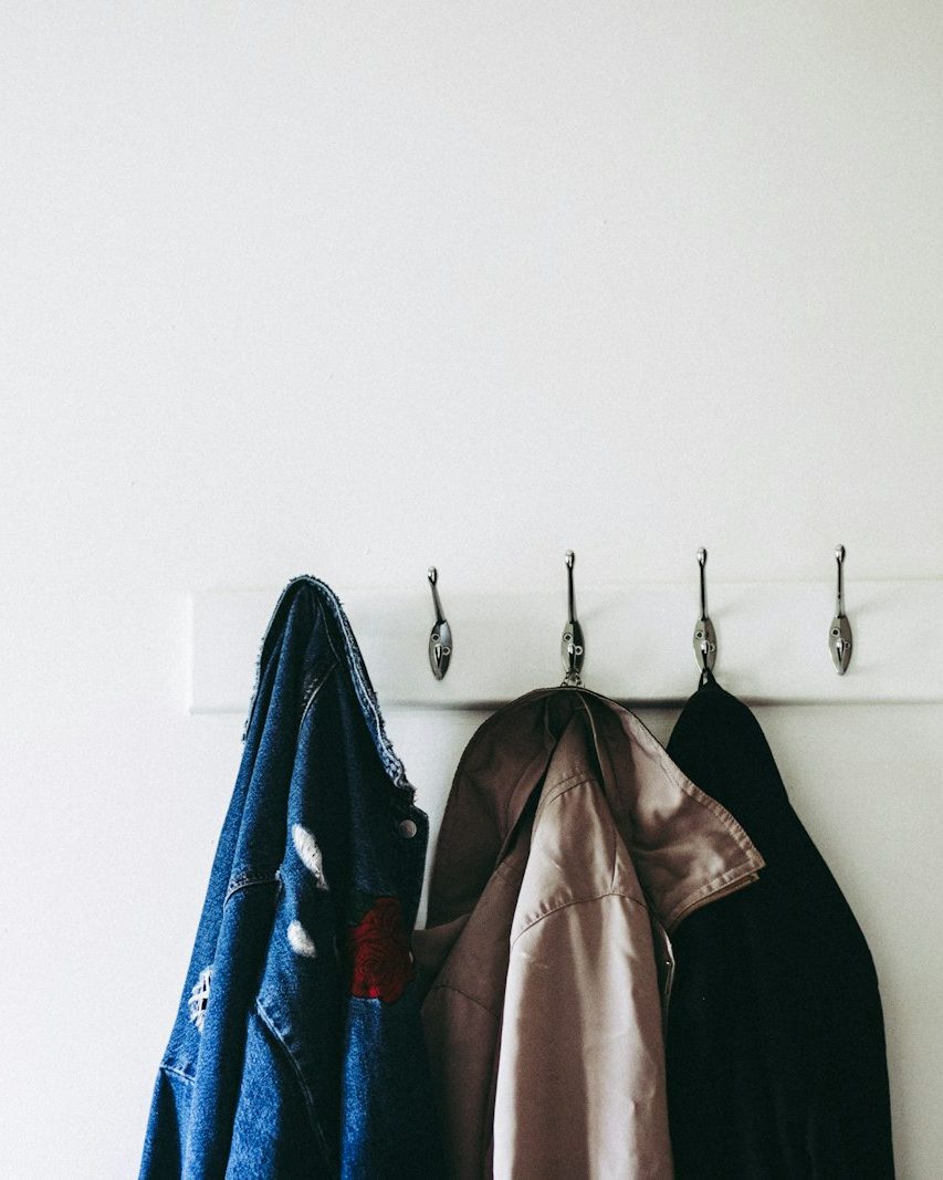 jackets hanging on wall hooks